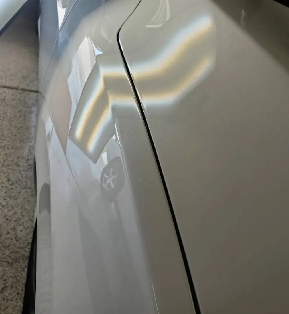 Sharp body-line crease dent removed with advanced PDR and glue-pull technique in Mesa, AZ, after