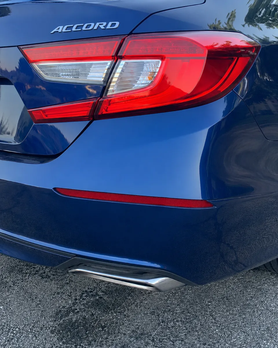 Honda Accord rear bumper dent removed without repainting in Apache Junction, AZ, after