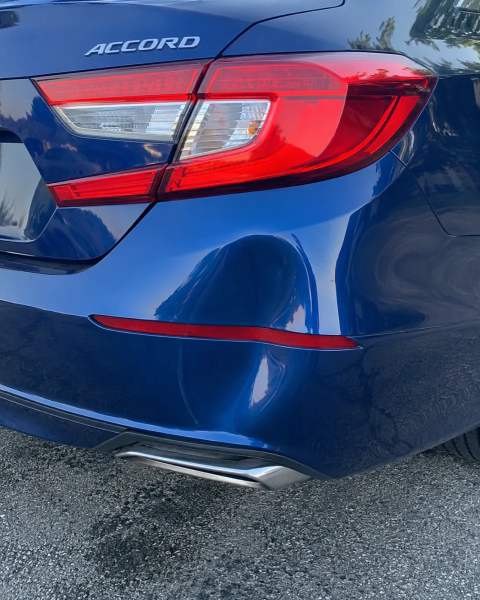 Honda Accord rear bumper dent removed without repainting in Apache Junction, AZ, before