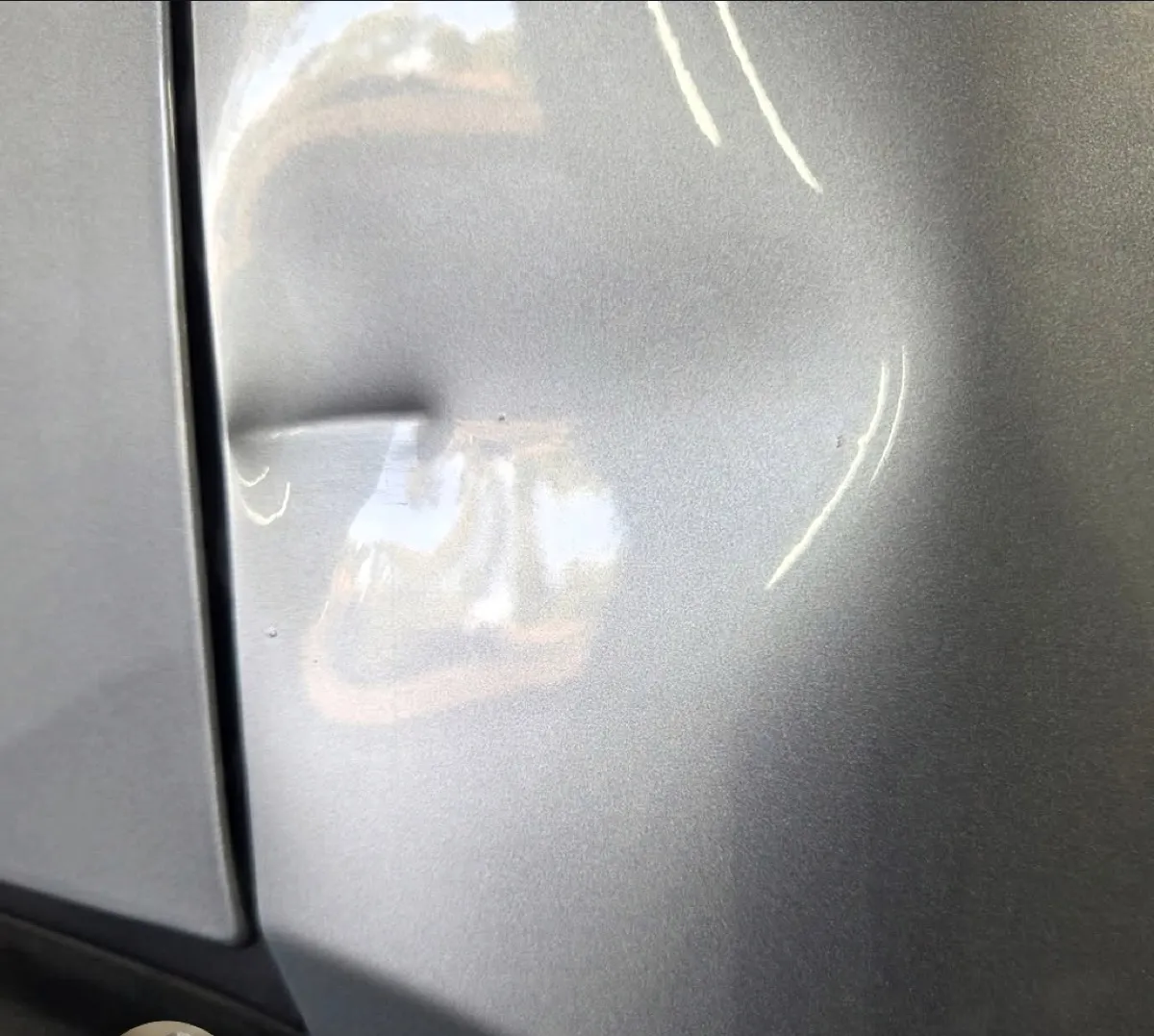 Large dent by the door seam removed with paintless dent repair in Apache Junction, AZ, before