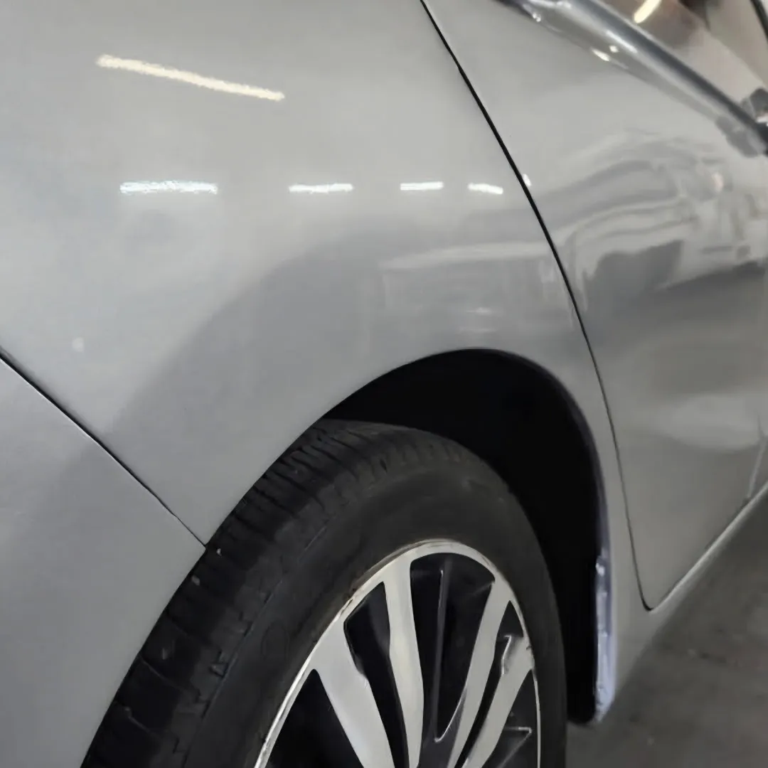 Body-line dent from a low-speed collision removed without repainting in Apache Junction, AZ, after