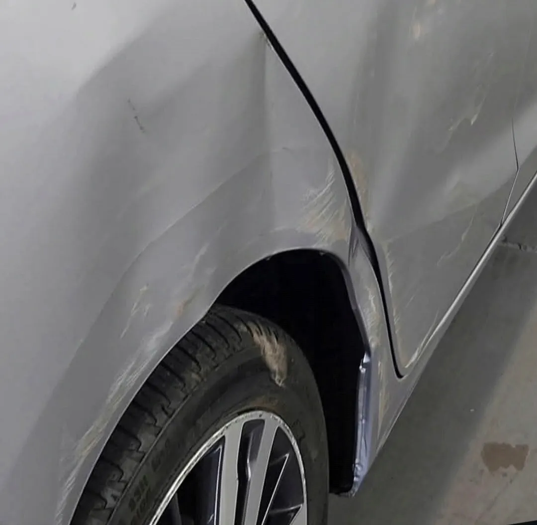 Body-line dent from a low-speed collision removed without repainting in Apache Junction, AZ, before