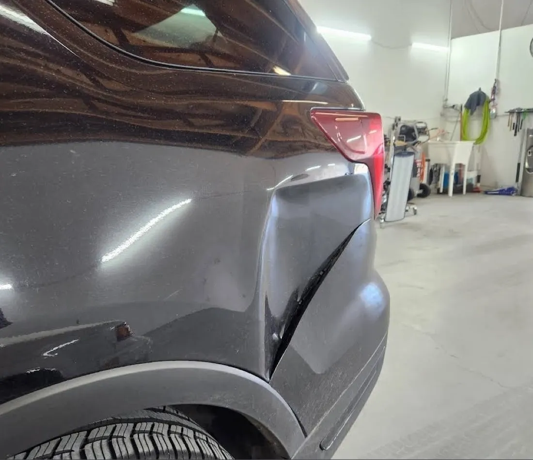 Dent on an SUV rear quarter panel removed with paintless dent repair in Apache Junction, AZ, after